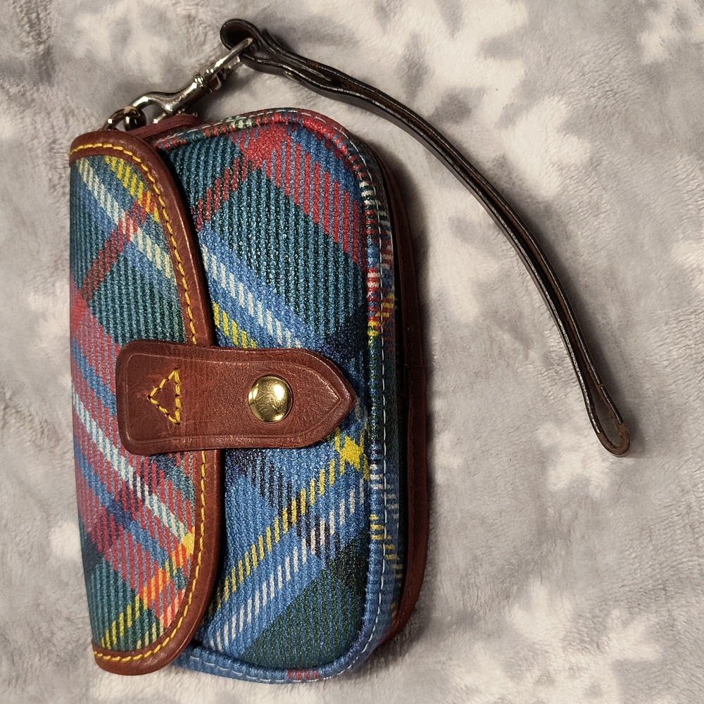Dooney & Bourke snap closure wristlet, GUC, some rust stain inside.
